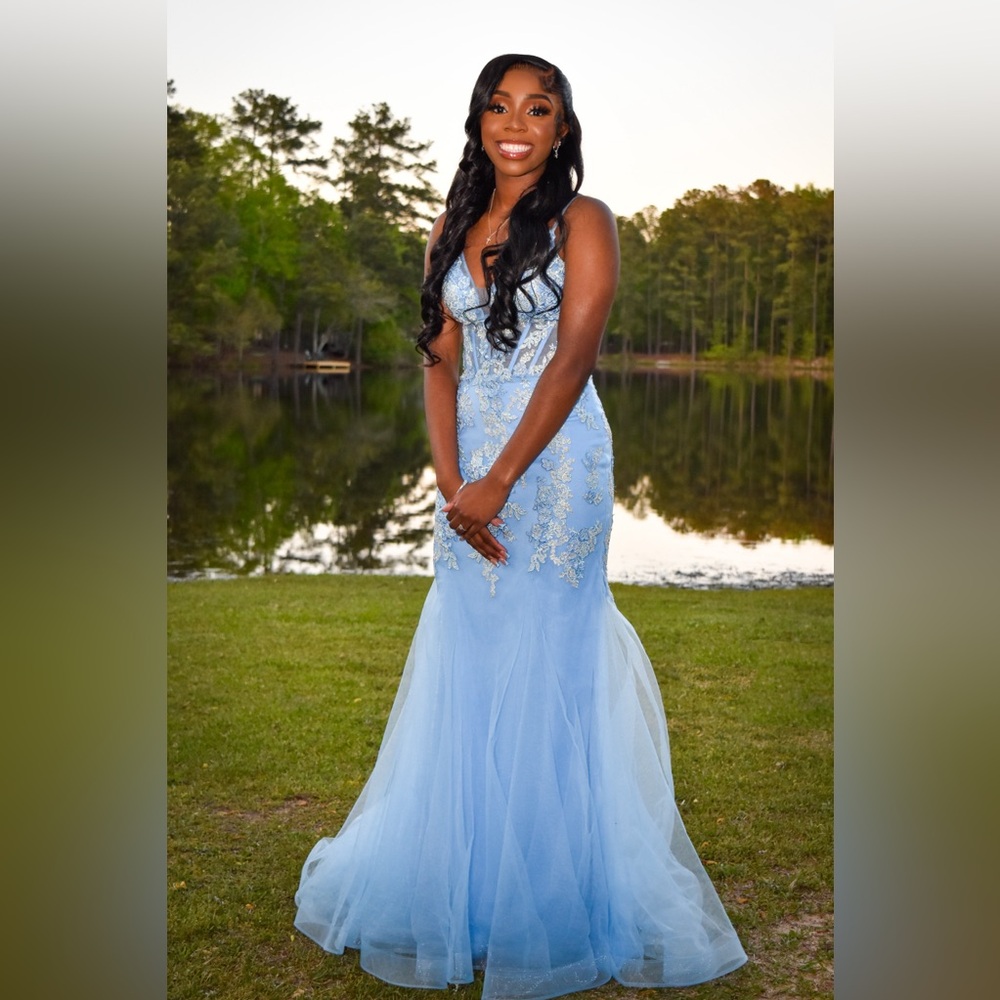 Beautiful and elegant prom dress. Light blue and only worn once. Perfect w/heels